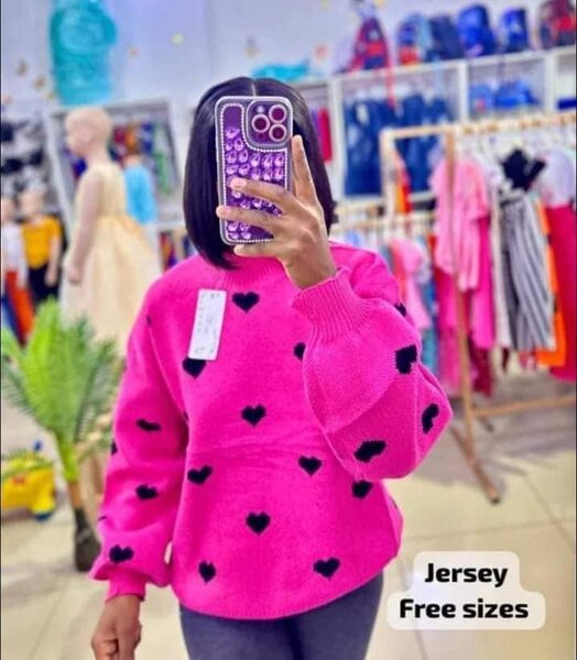 Pink sweater with black heart print