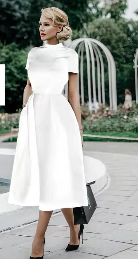 Women's white dress with short sleeves and skirt