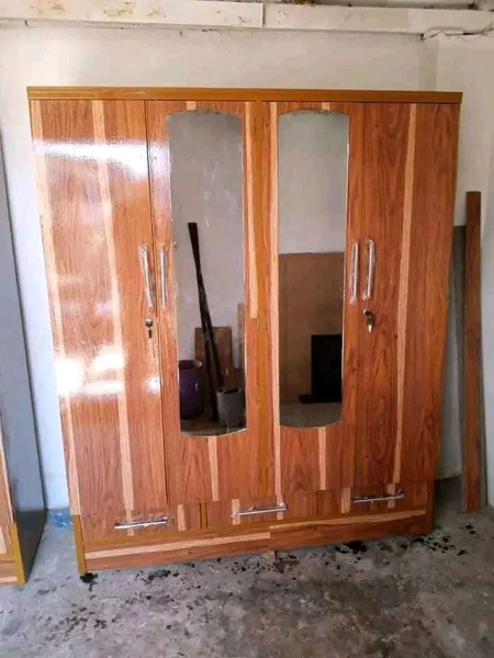 brown cabinet with two mirrors