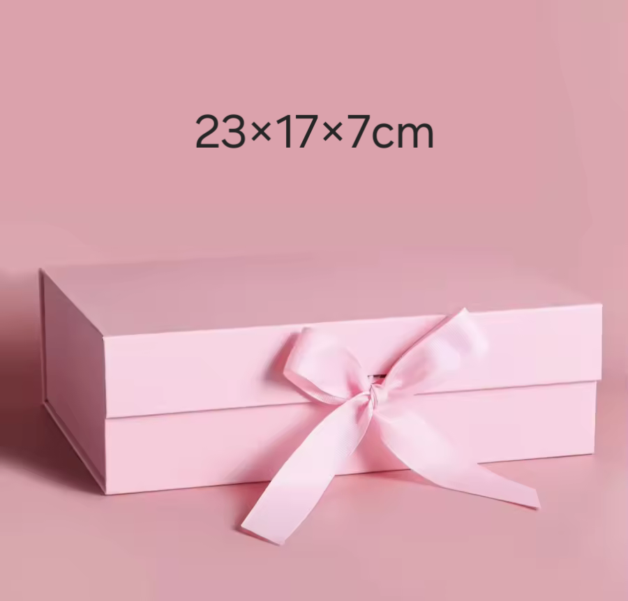 Boîte cadeau rose avec ruban