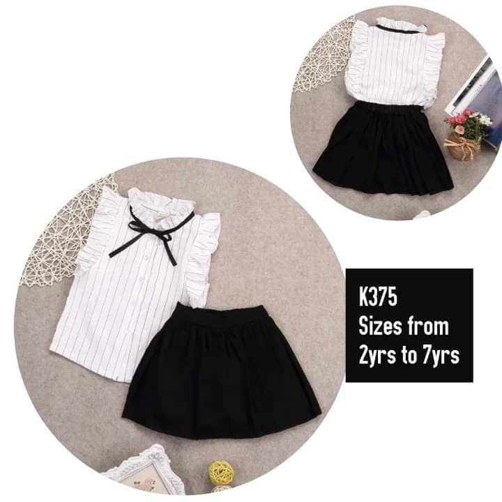 white top and black skirt