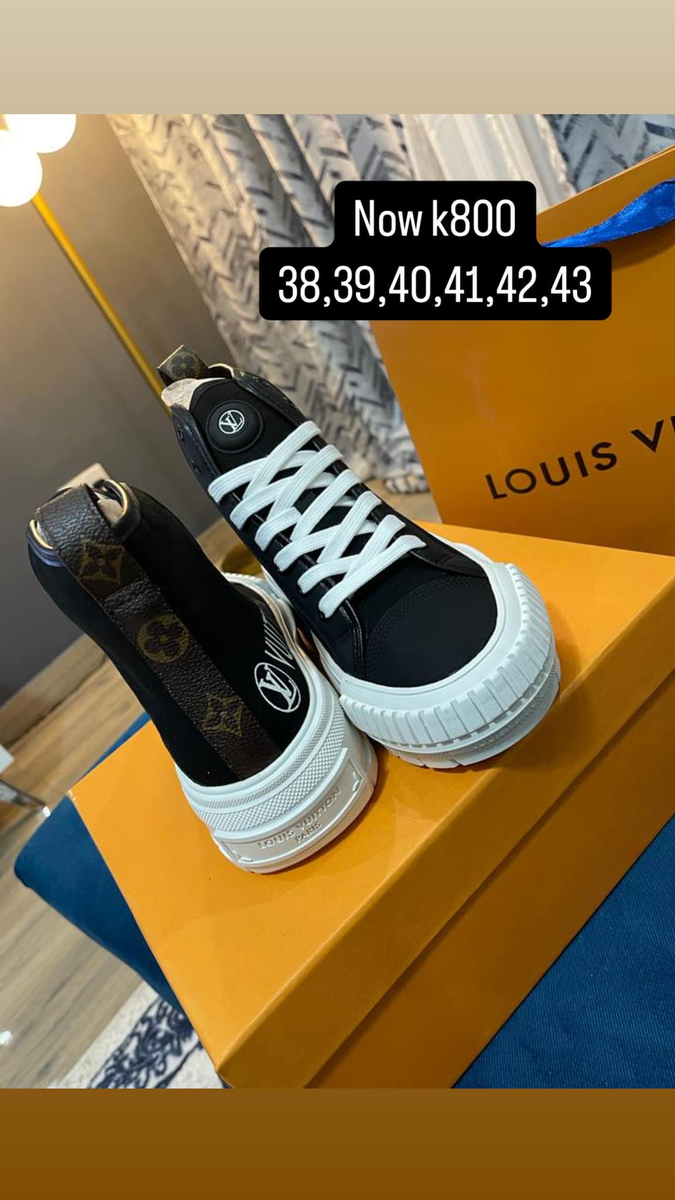 black sneakers with white laces