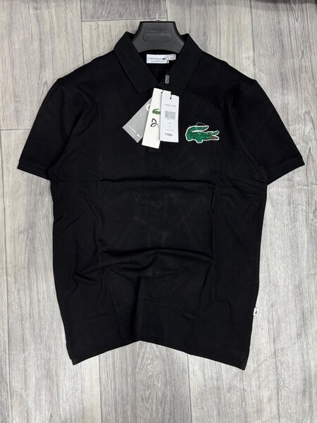 Polo noir élégant Lacoste