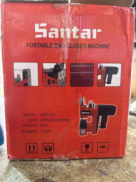 Portable sack sewing machine