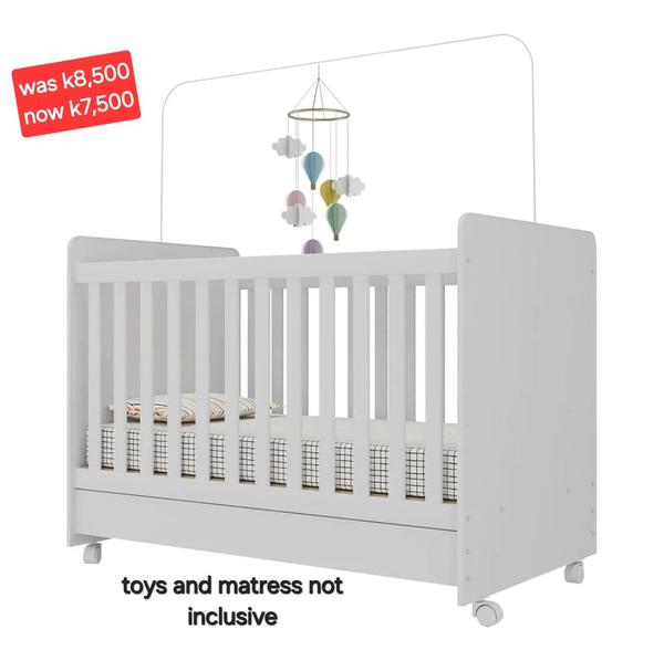 white wooden crib