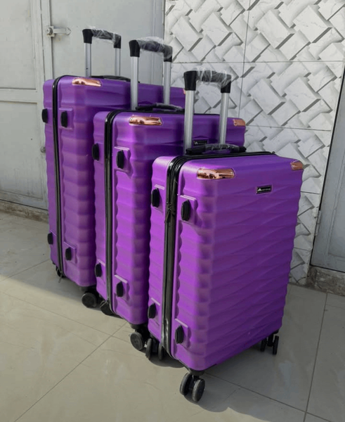 Valise à roulettes violette