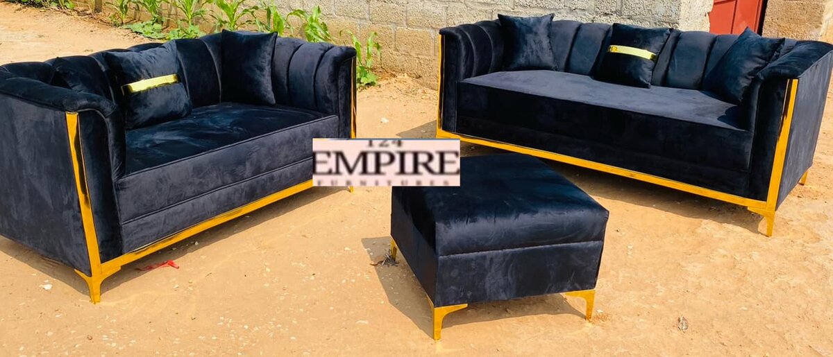 Black upholstered sofa and ottoman