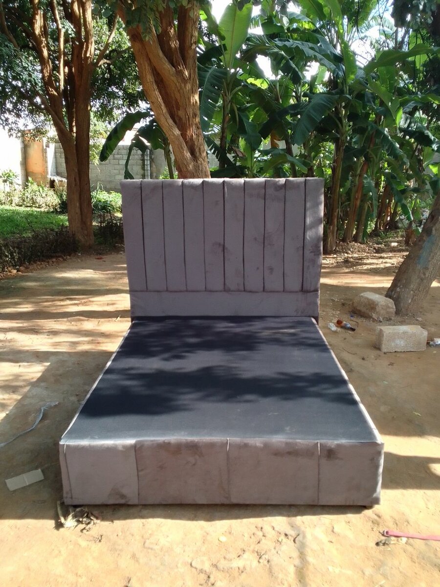 Gray double bed and headboard