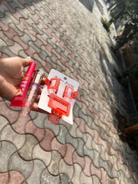 Hair clips, lip gloss and bracelets