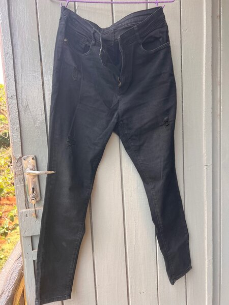 Black ripped jean and blue jeans