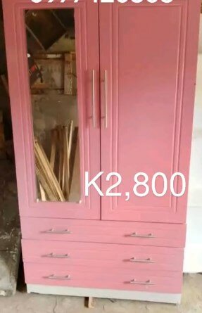 Pink wardrobe with drawers and mirror