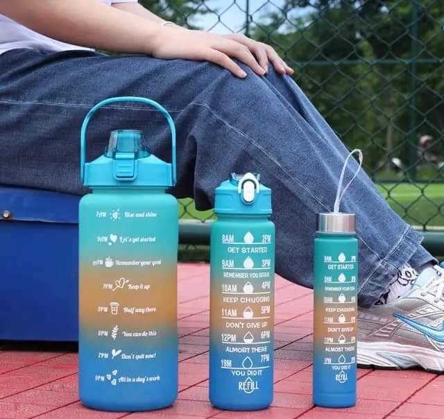 Bouteilles d'eau graduées motivantes