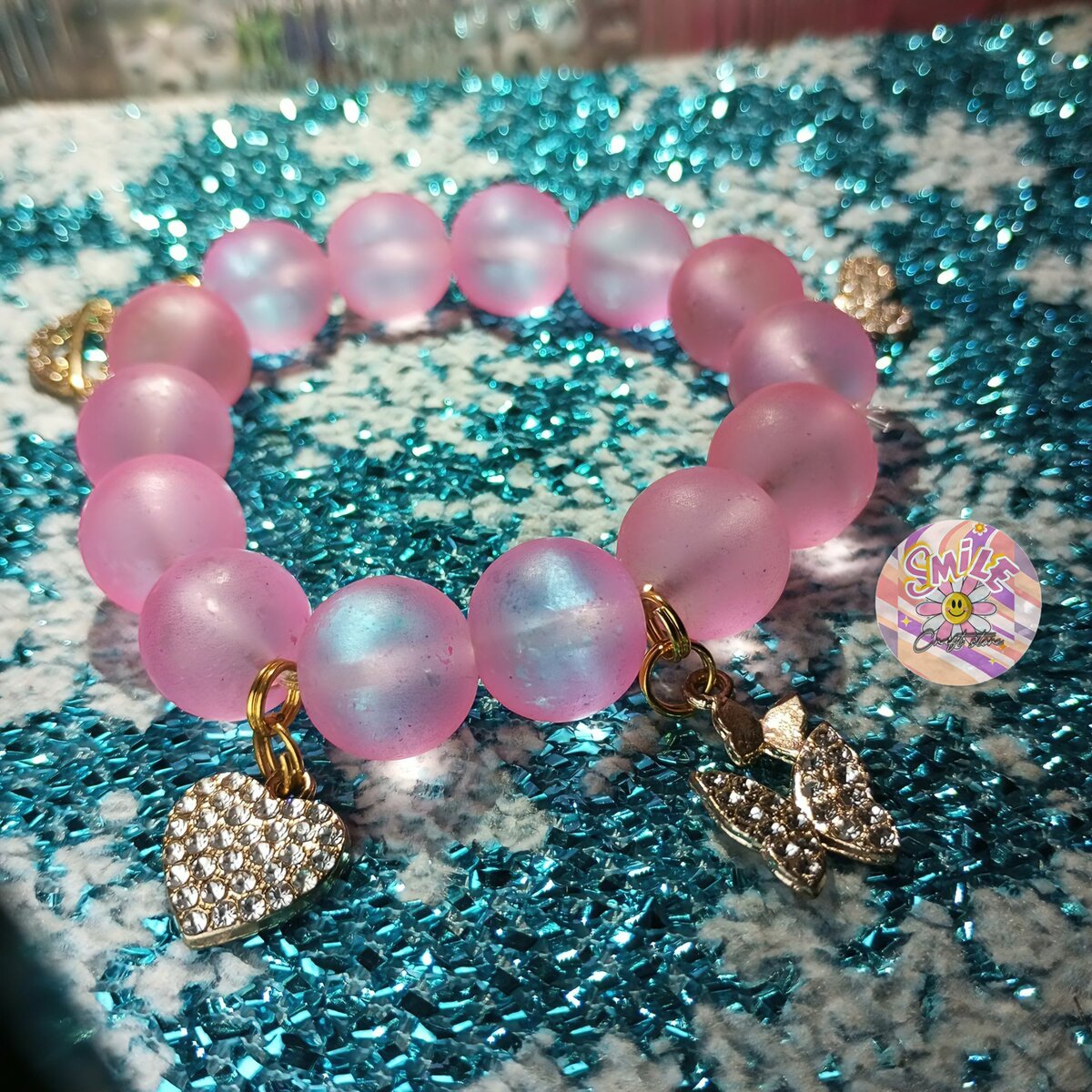 Pink charmed bracelet