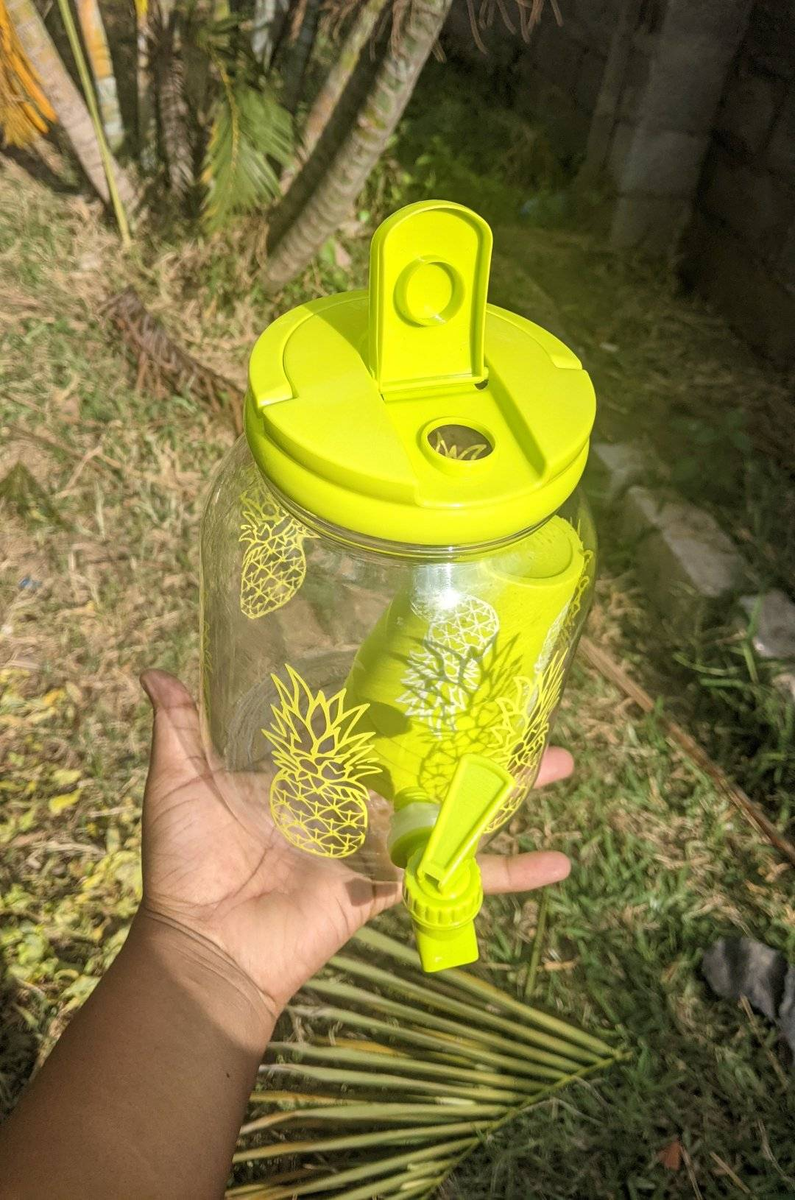 Portable juice jug with a dispenser yellow