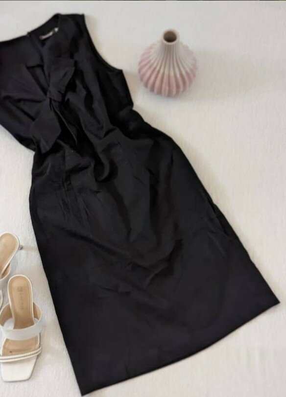 Black dress with a bow on the chest