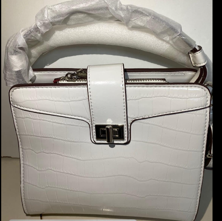 Women's white bag with embossed crocodile leather, handle and rotary lock