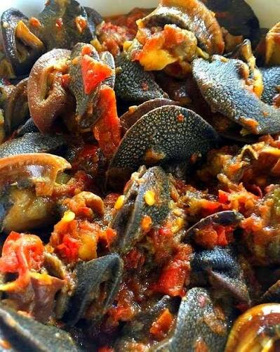 Escargots en sauce épicée