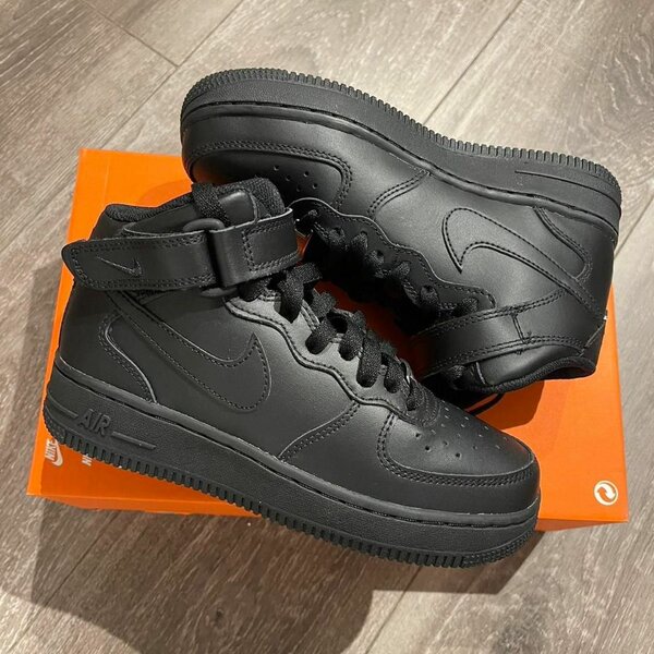 Sneakers montantes en cuir noir