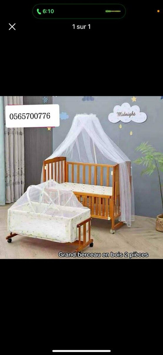 Lit bébé en bois avec moustiquaire