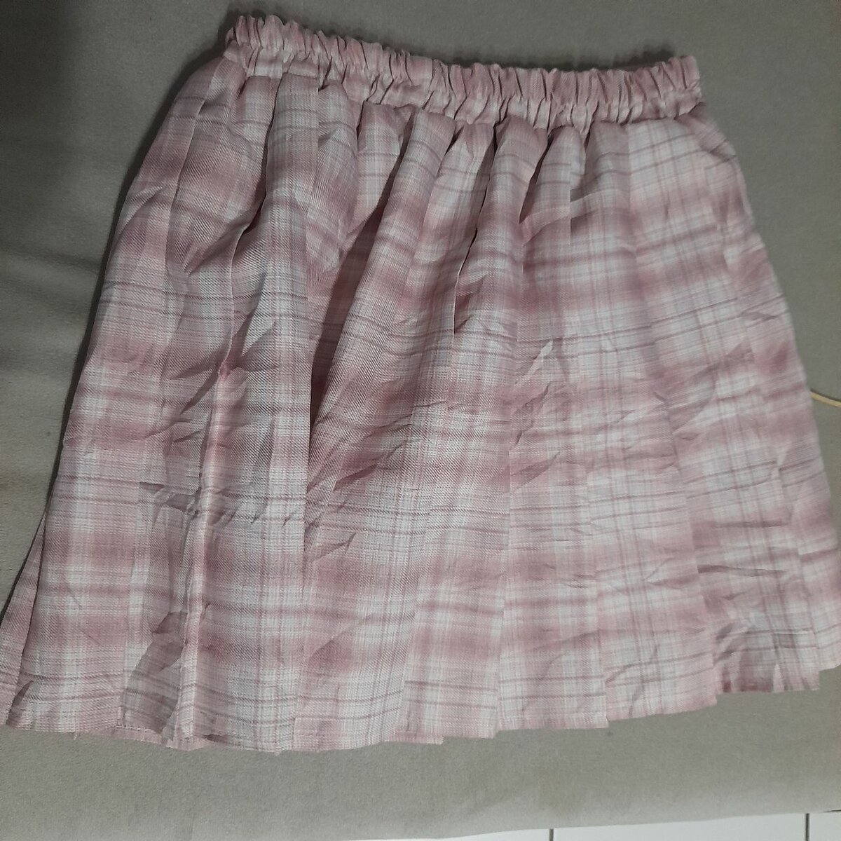 Jupe plissée à carreaux rose