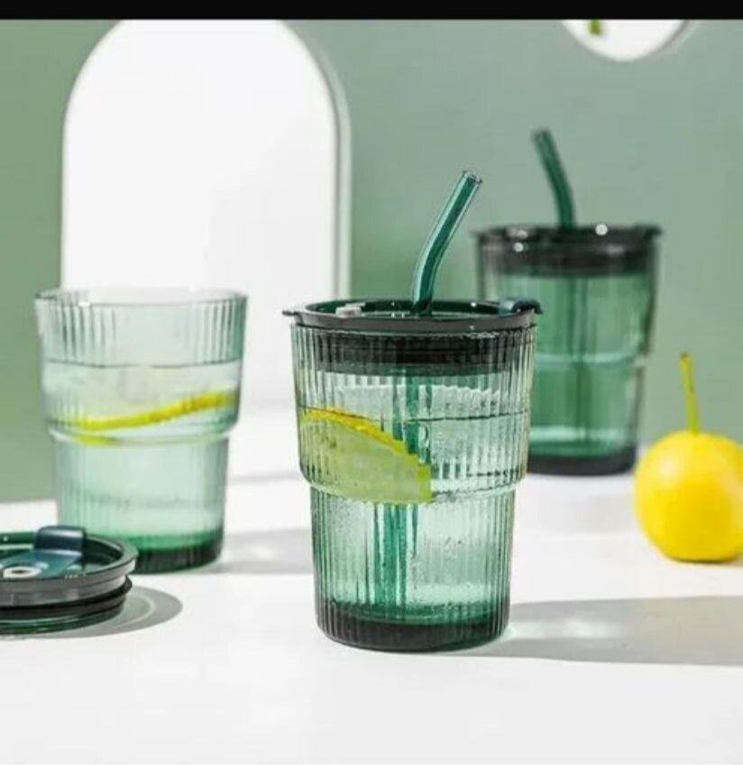 Glass cup with straw