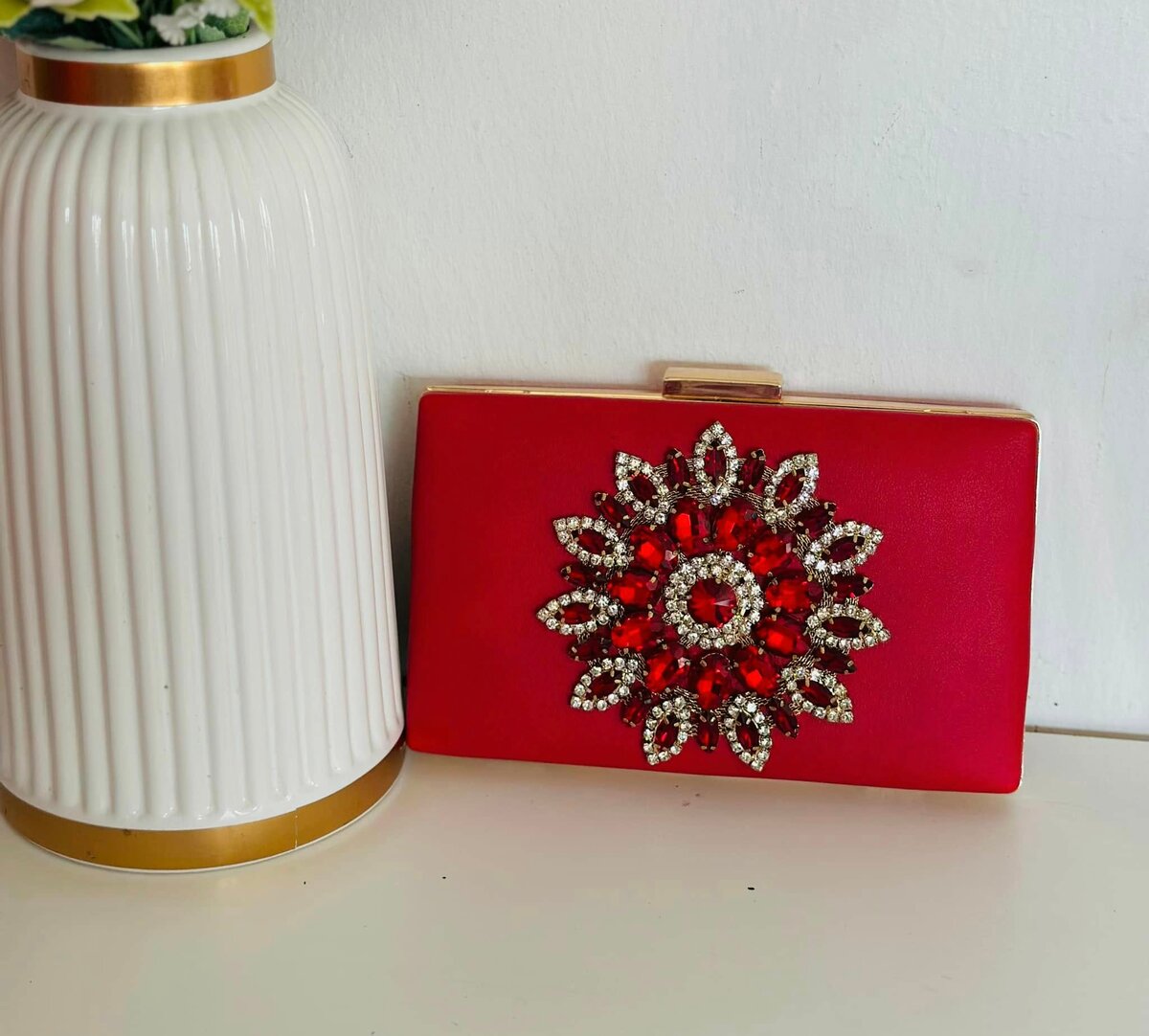 Red clutch, decorated with rhinestones