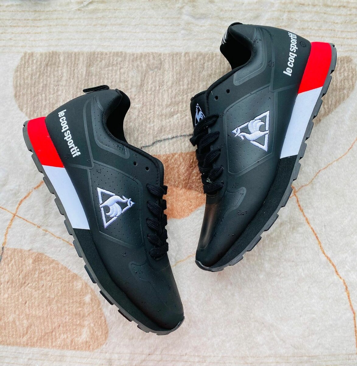 Ie coq sportif