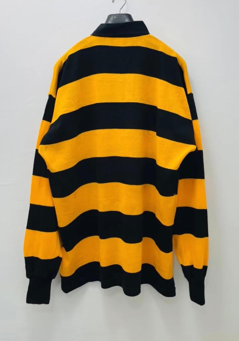 Polo rayé jaune et noir