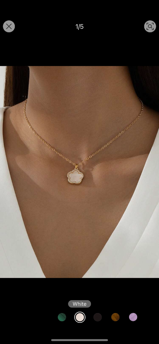 white flower pendant with stones