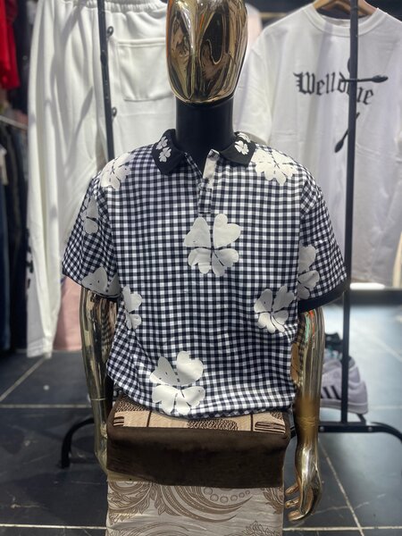 Polo chemise à motifs floraux