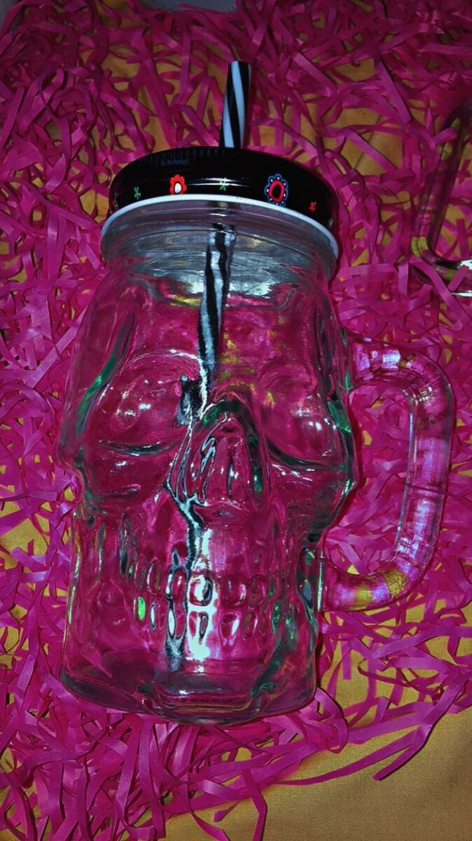 Glass jar with straw