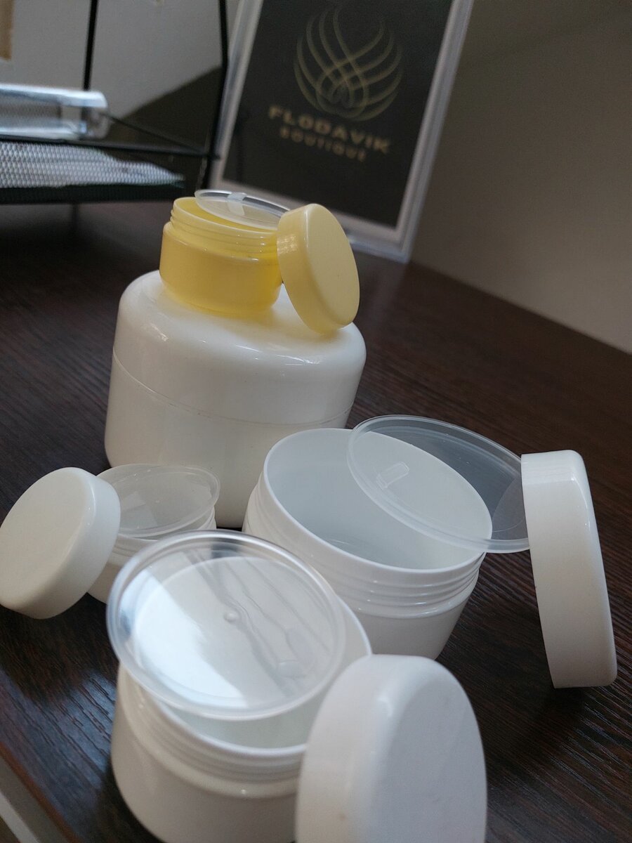 White jars with inner covers