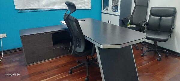 Executive table with a lockable safe using codes.