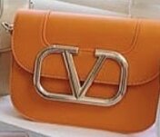 Beautiful fashionable women's handbag color orange