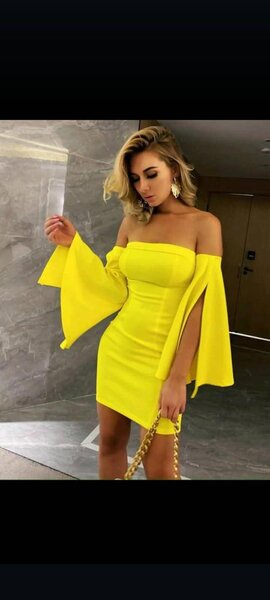 Elegant and comfortable women's dress with open shoulders yellow