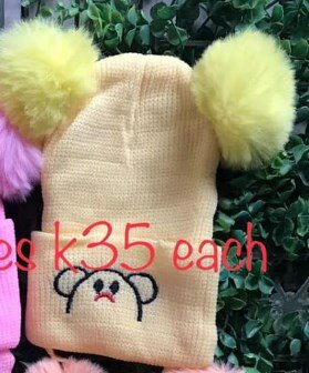 Beanie with 2 pompoms and ties, beige