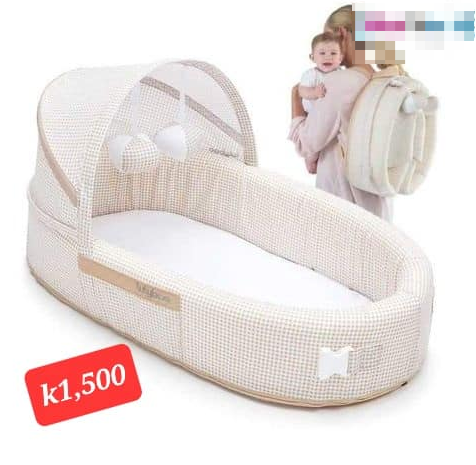 beige backpack crib