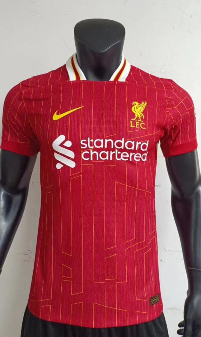 Liverpool men's soccer uniform in red with Nike and Standard Chartered logos