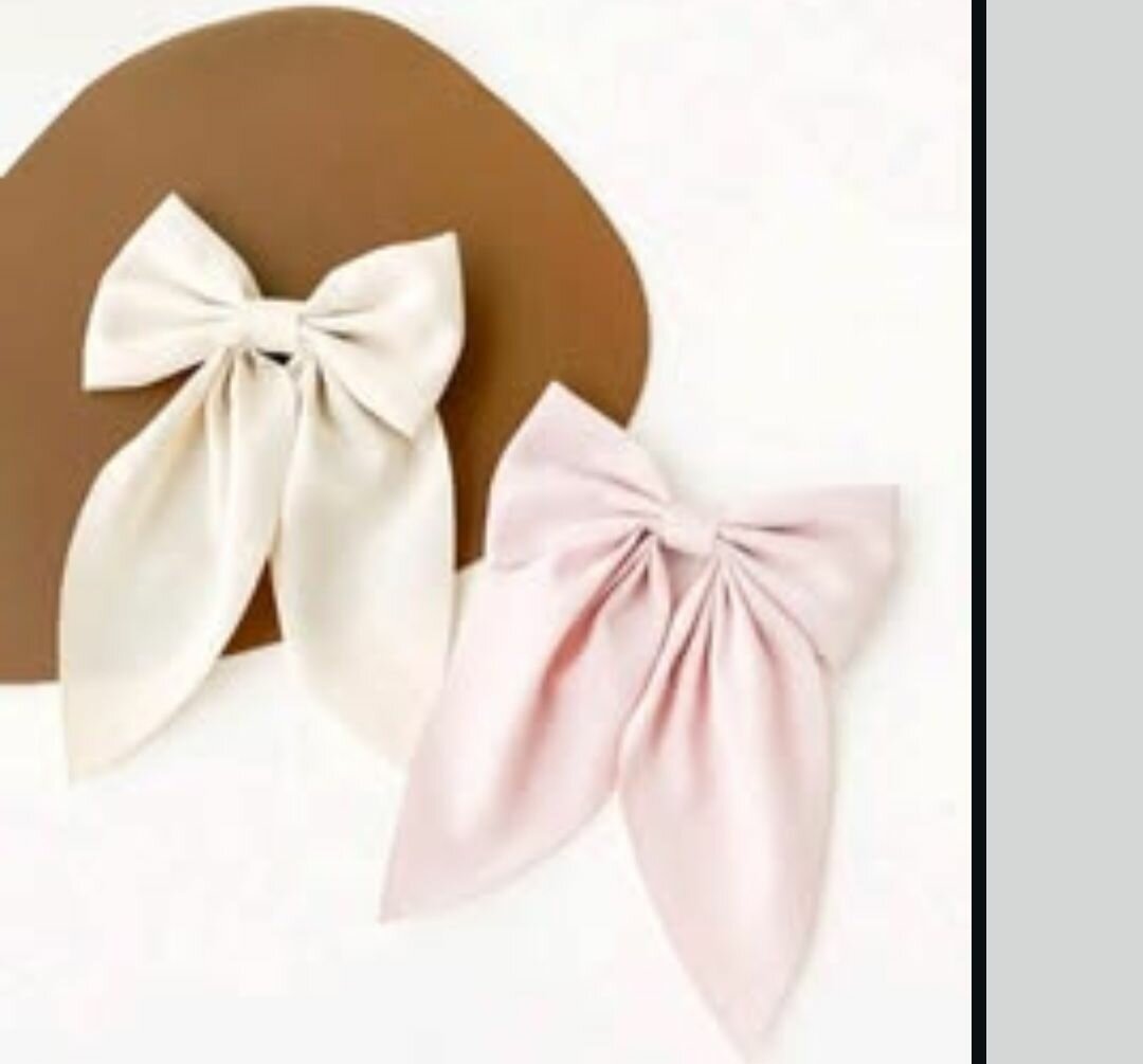 Big black bow and small pink and white bows
