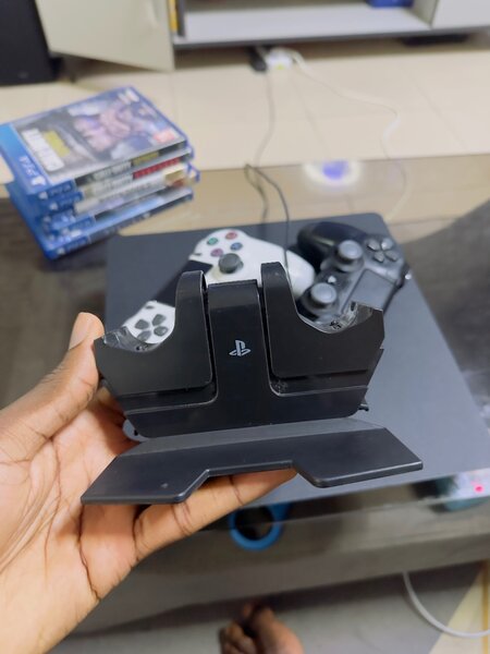 PlayStation 4 with 12 games including 2 original pads