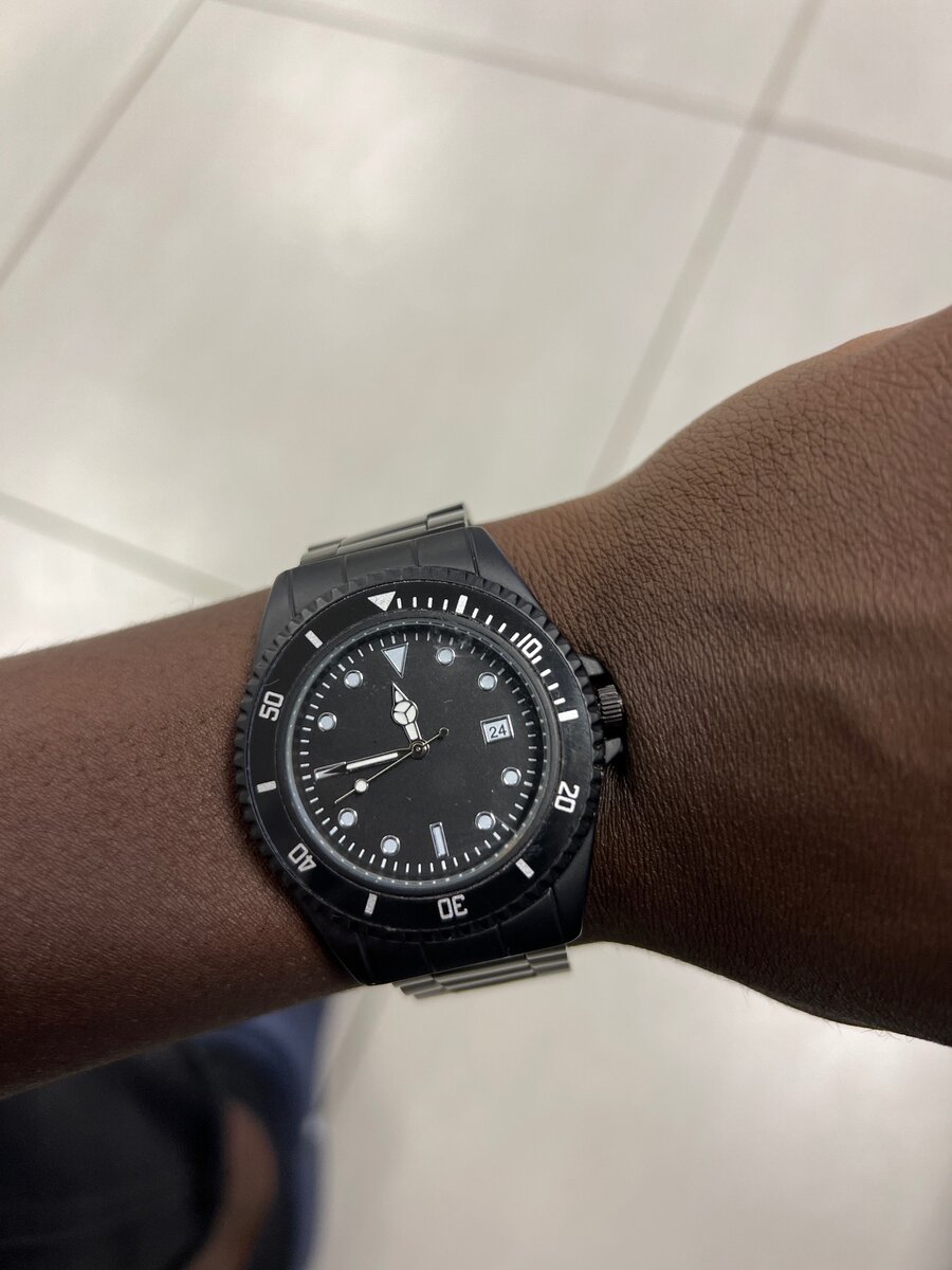 Quartz black on black mens wrist watch.