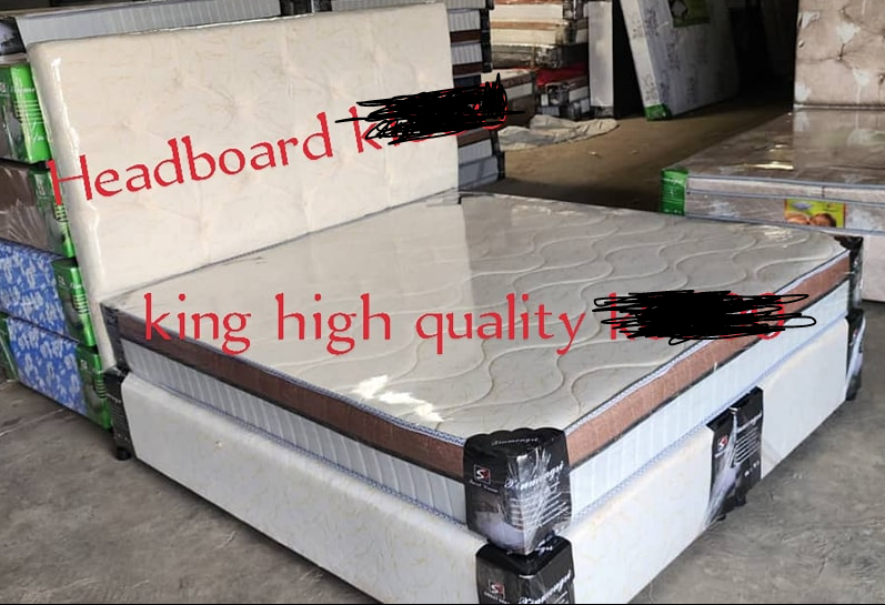 a bed with a mattress and a headboard