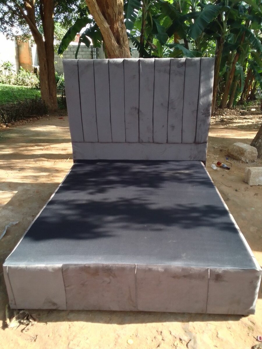 Gray double bed and headboard