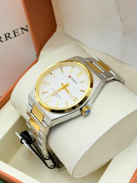 Montre homme dorée et argentée