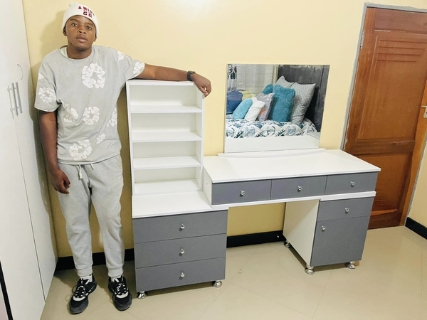 grey and white makeup table with mirror