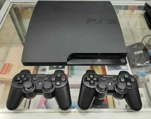 Console Sony PlayStation 3 avec 2 manettes