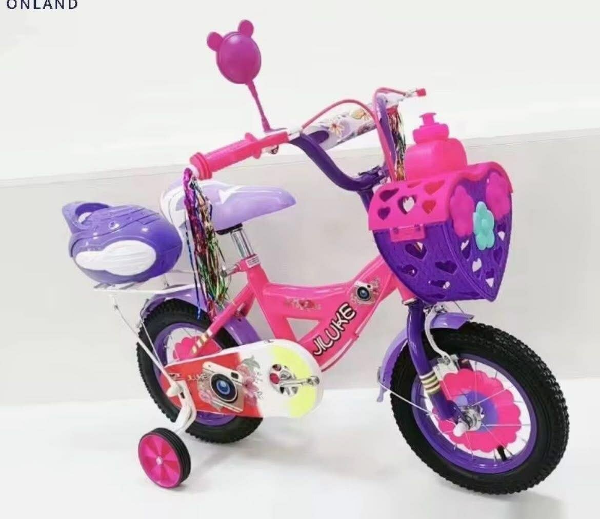 Vélo enfant rose avec paniers