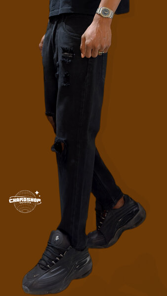 Jeans noirs déchirés homme