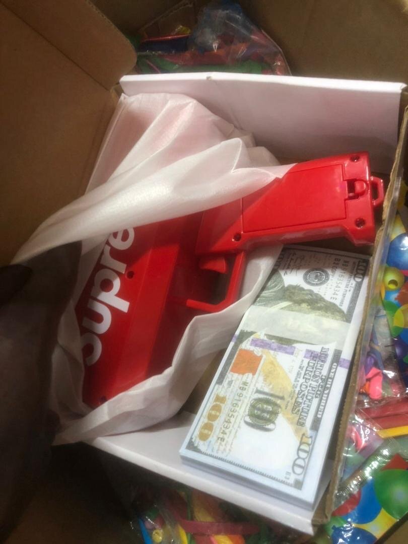 Pistolet à billets amusant rouge