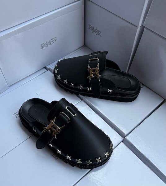 Mules noires avec boucles élégantes